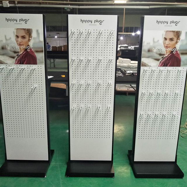 Pr&eacute;sentoir perfor&eacute; vertical de marque Happy Plugs pour l'&eacute;lectronique